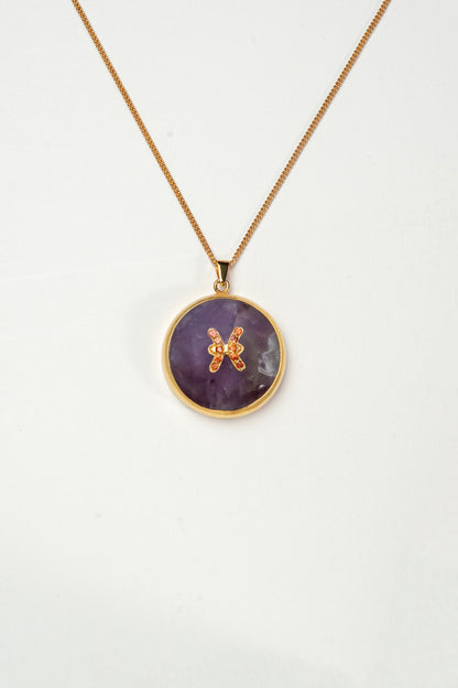Pisces zodiac pendant: Amethyst cabochon and orange sapphires.

Amuleto de Piscis Amatista cabujón y zafiros naranjas.