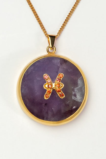Pisces zodiac pendant: Amethyst cabochon and orange sapphires.

Amuleto de Piscis Amatista cabujón y zafiros naranjas.
